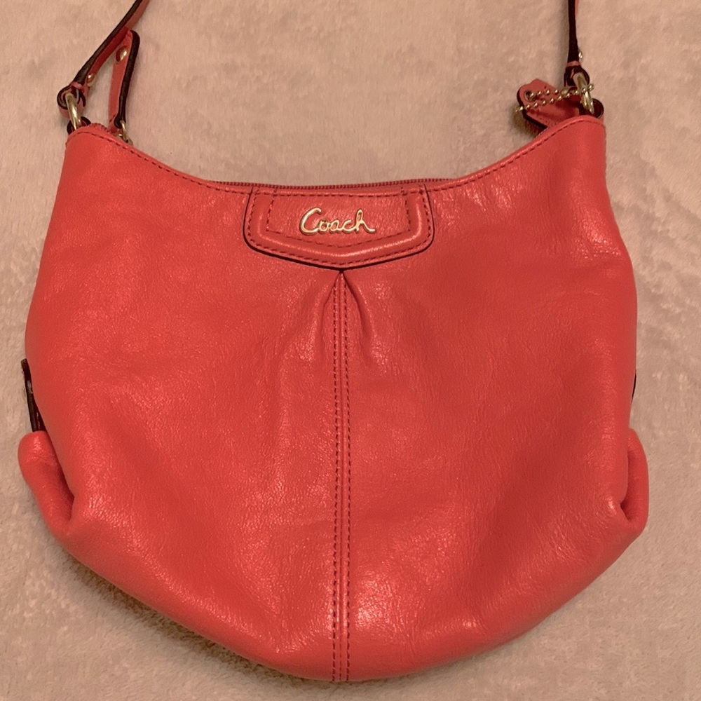 *Slightly used orange Coach small purse.